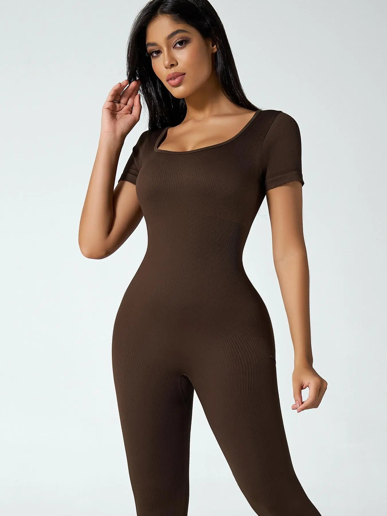Mono deportivo de manga larga para mujer THE LJM en ribete sólido con control de abdomen y diseño ajustado.