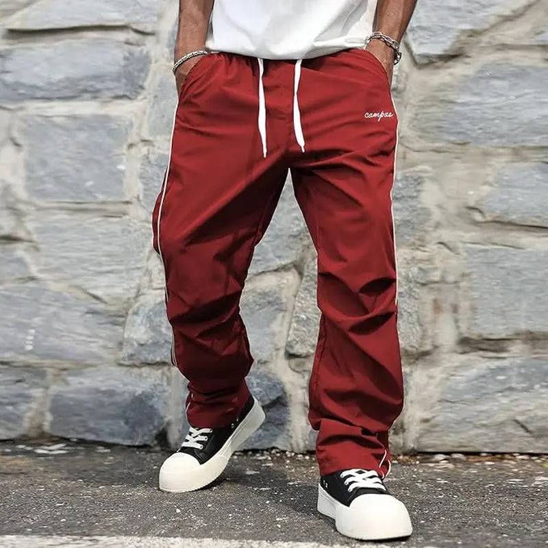 Pantalones street Shadow Line de THE LJM en color oscuro, con diseño ajustado y cinturilla elástica para un estilo urbano.